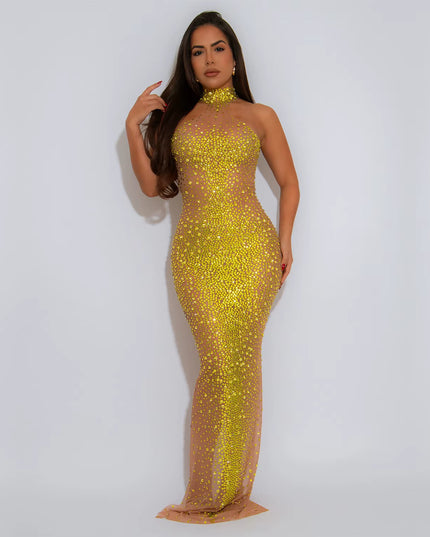 Woman wearing a yellow sequin dress against a white background
