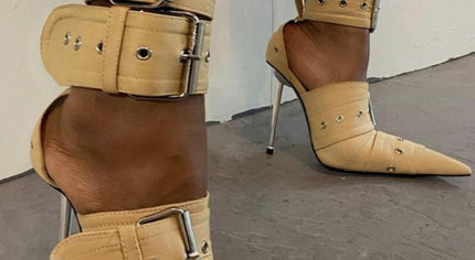 A pair of beige PU leather high heel sandals with pointed toes and adjustable buckle straps.