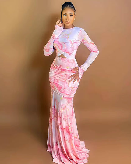 Woman wearing a pink and white floral dress against a brown background